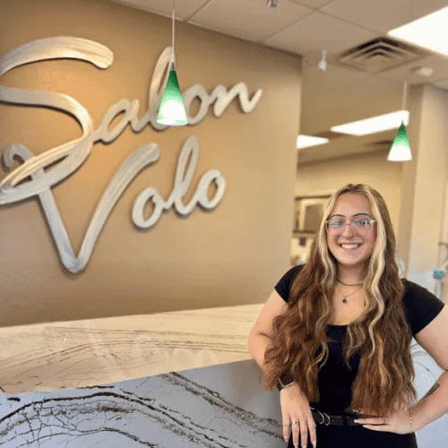 Portrait of Trinity Young, a professional stylist at Salon Volo Inc., showcasing their expertise and style.