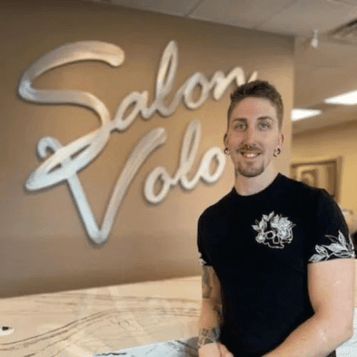 Portrait of Johnny Argue, a professional stylist at Salon Volo Inc., showcasing their expertise and style.