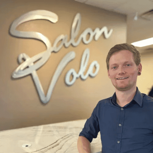 Portrait of Joey Fletcher, a professional stylist at Salon Volo Inc., showcasing their expertise and style.