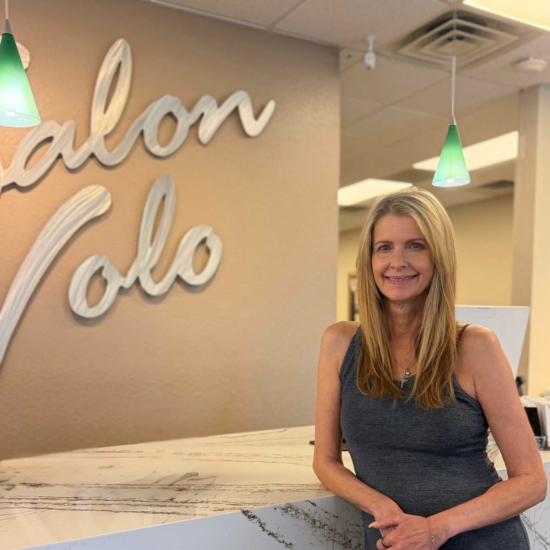Portrait of Karen Kelly, a professional stylist at Salon Volo Inc., showcasing their expertise and style.