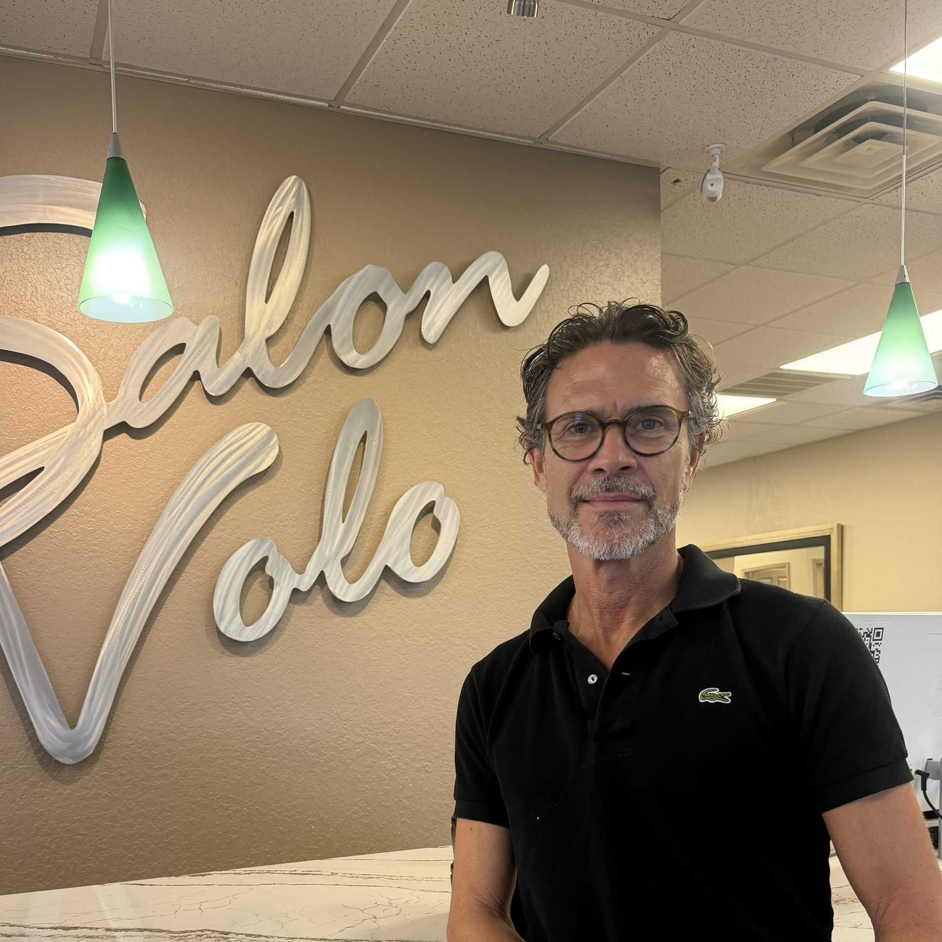 Portrait of Ira Leighton, a professional stylist at Salon Volo Inc., showcasing their expertise and style.