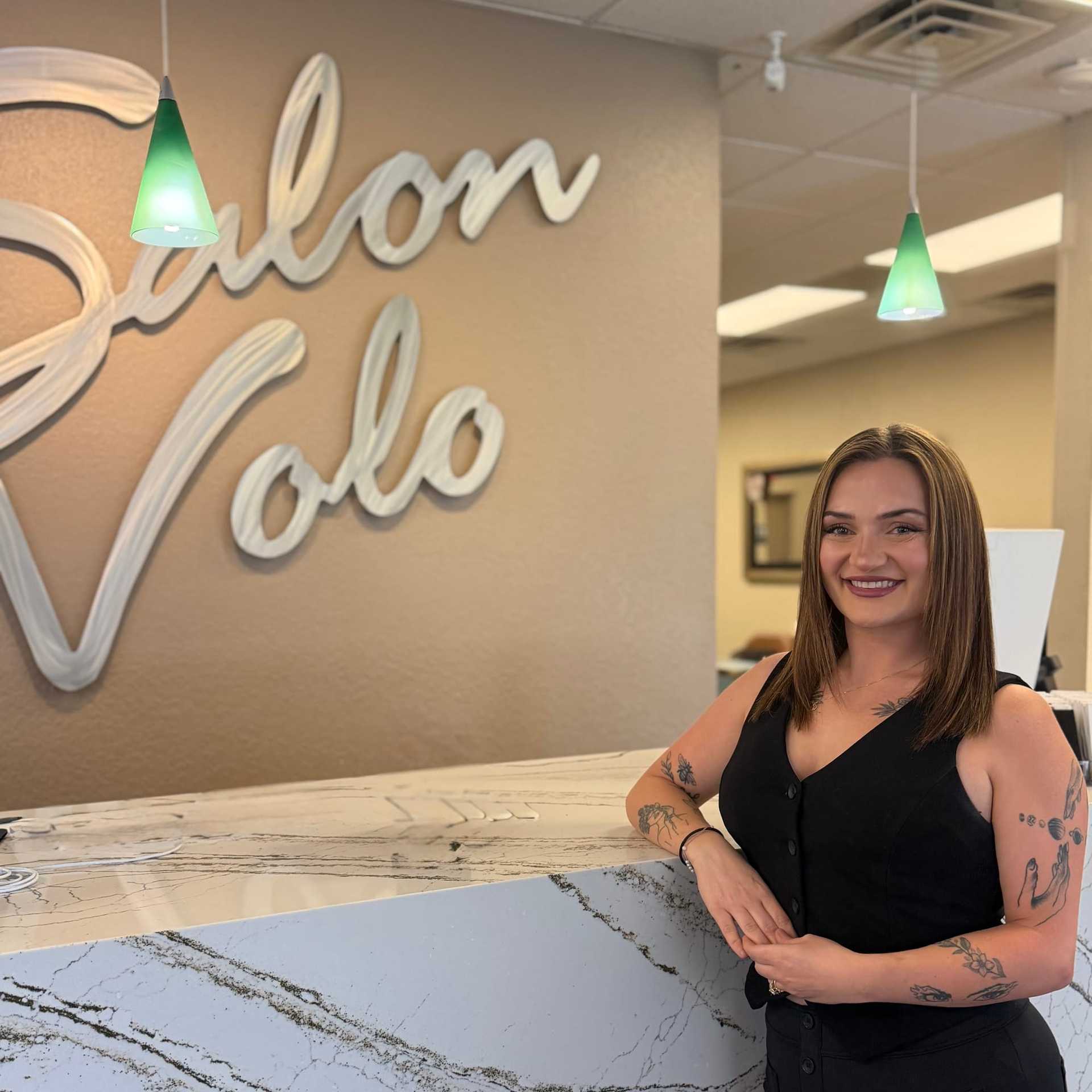 Portrait of Hannah DeVega, a professional stylist at Salon Volo Inc., showcasing their expertise and style.