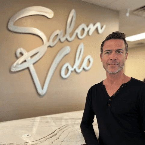 Portrait of Ira Leighton, a professional stylist at Salon Volo Inc., showcasing their expertise and style.