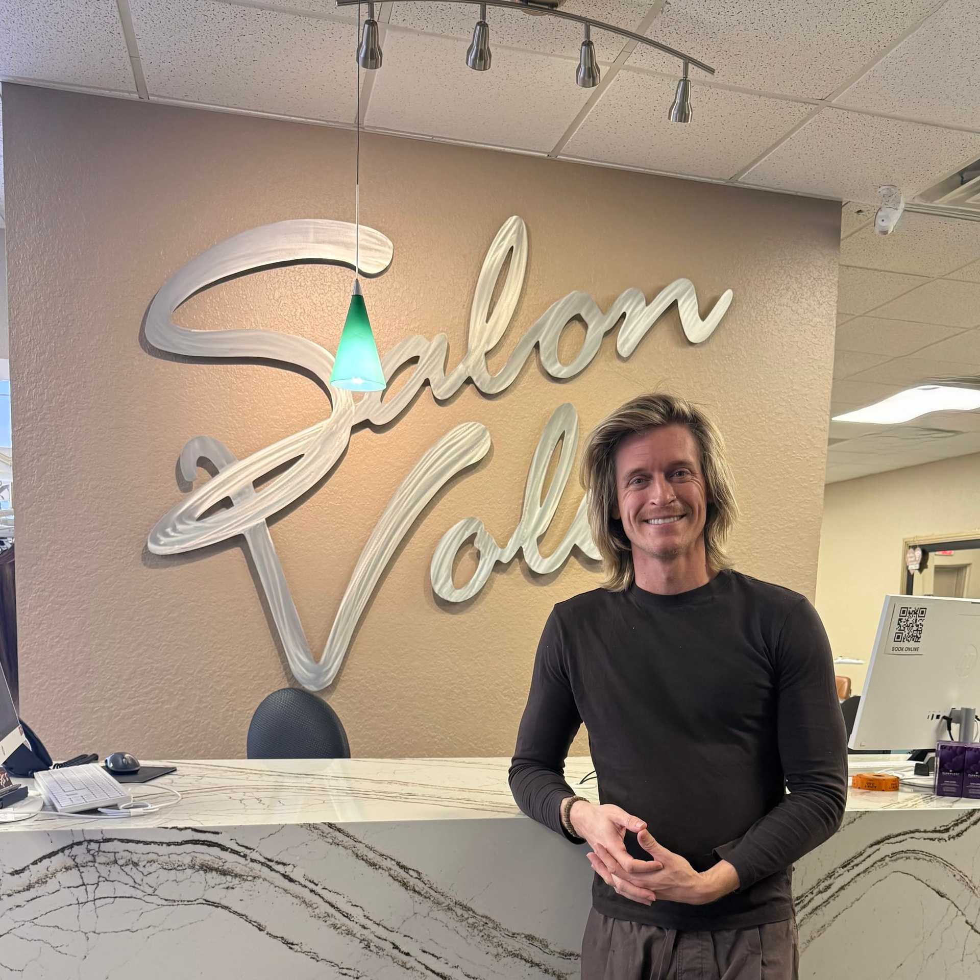 Portrait of Aaron Clarke, a professional stylist at Salon Volo Inc., showcasing their expertise and style.
