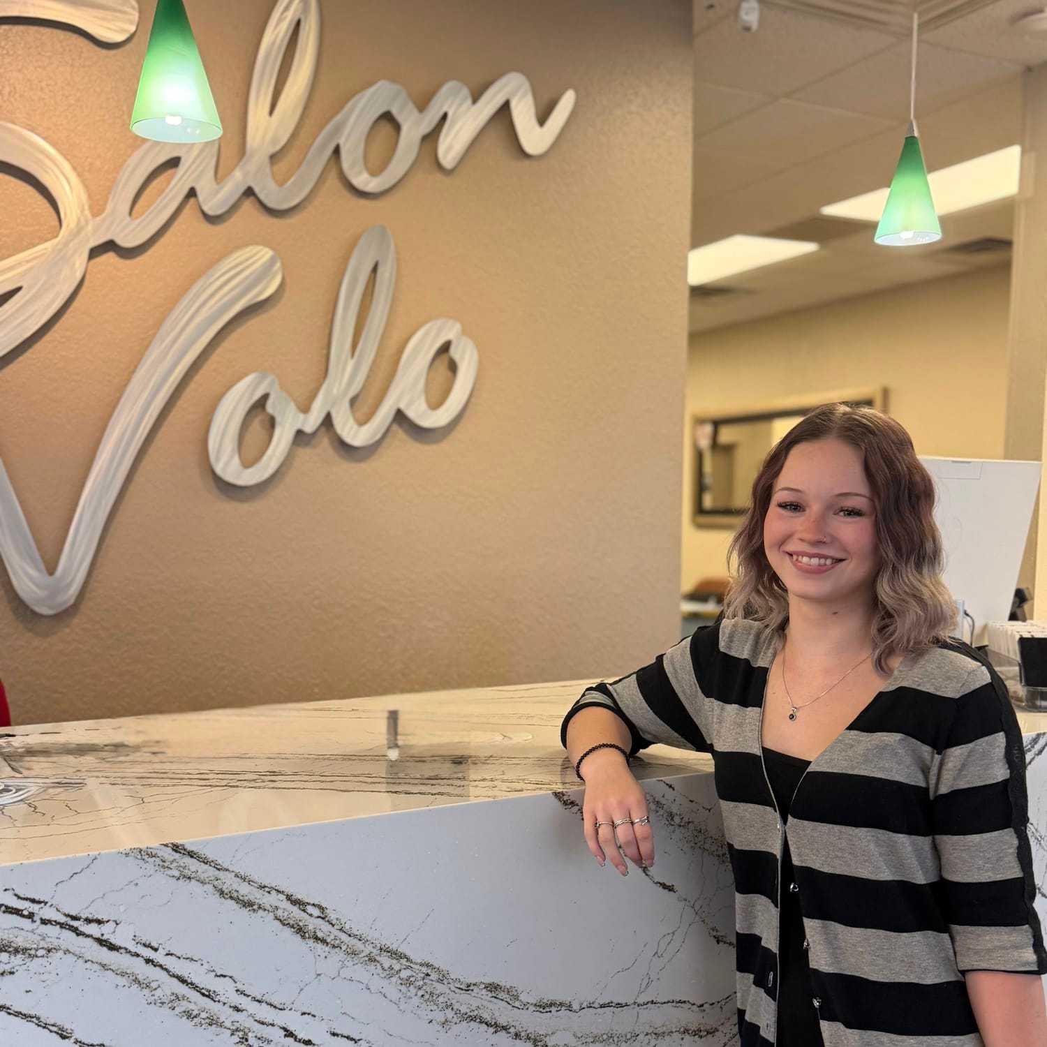 Portrait of Aubree Weisner, a professional stylist at Salon Volo Inc., showcasing their expertise and style.