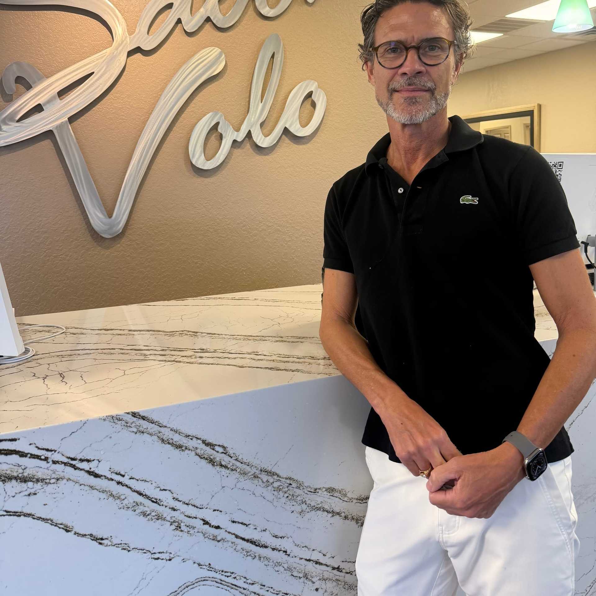 Portrait of Ira Leighton, a professional stylist at Salon Volo Inc., showcasing their expertise and style.