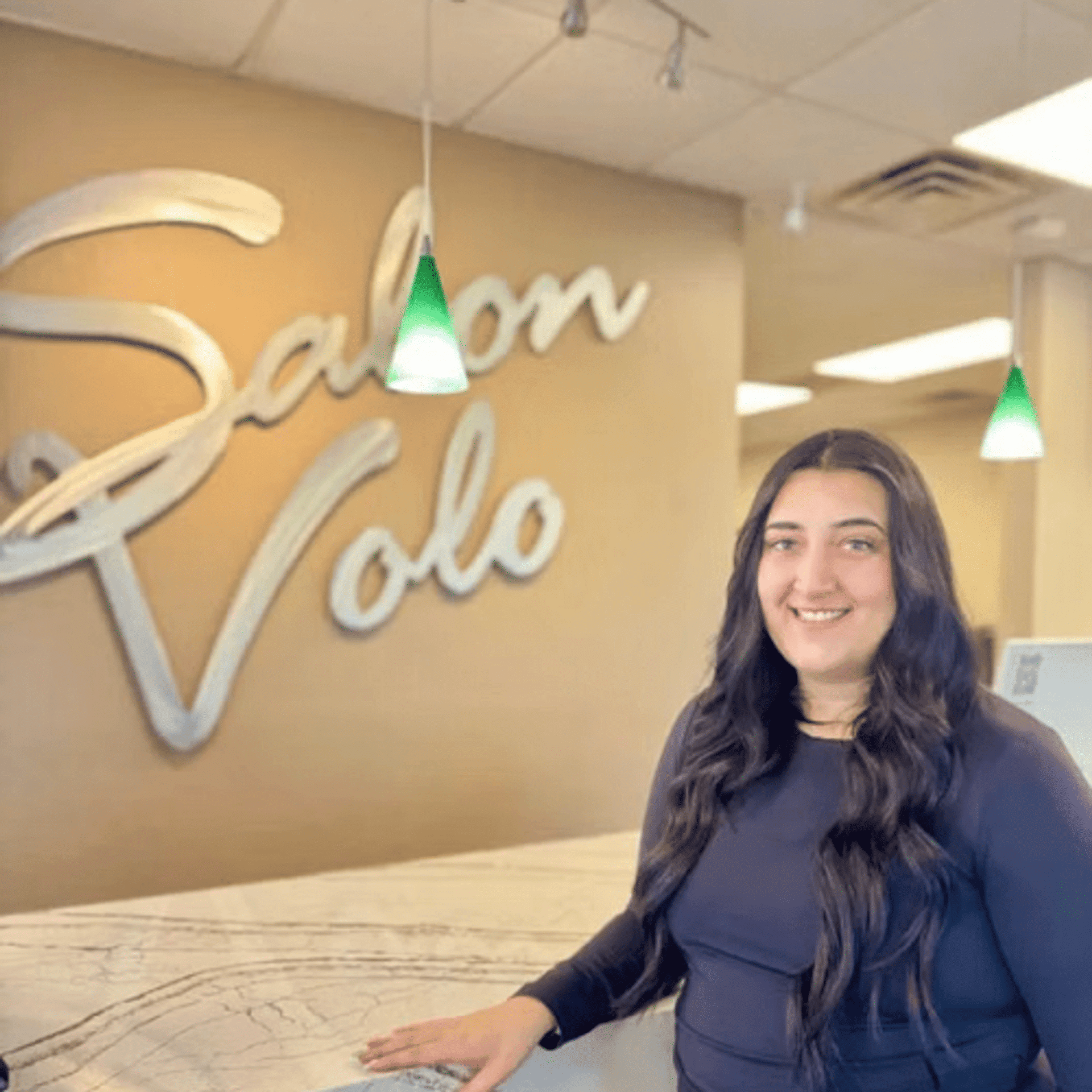 Portrait of Ashley Hatzopoulos, a professional stylist at Salon Volo Inc., showcasing their expertise and style.